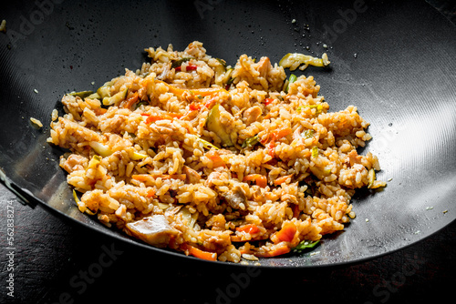 Chinese wok. Rice with beef and vegetables.