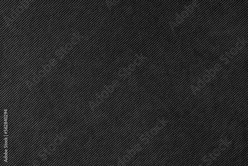 Texture background of velours black fabric. Upholstery velveteen texture fabric, corduroy furniture textile material, design interior, decor. Ridge fabric texture close up, backdrop, wallpaper.