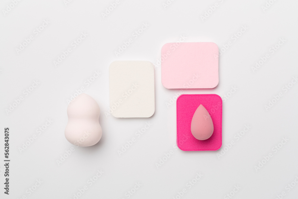 Beauty blenders on color background, top view Beauty blenders on color background, top view