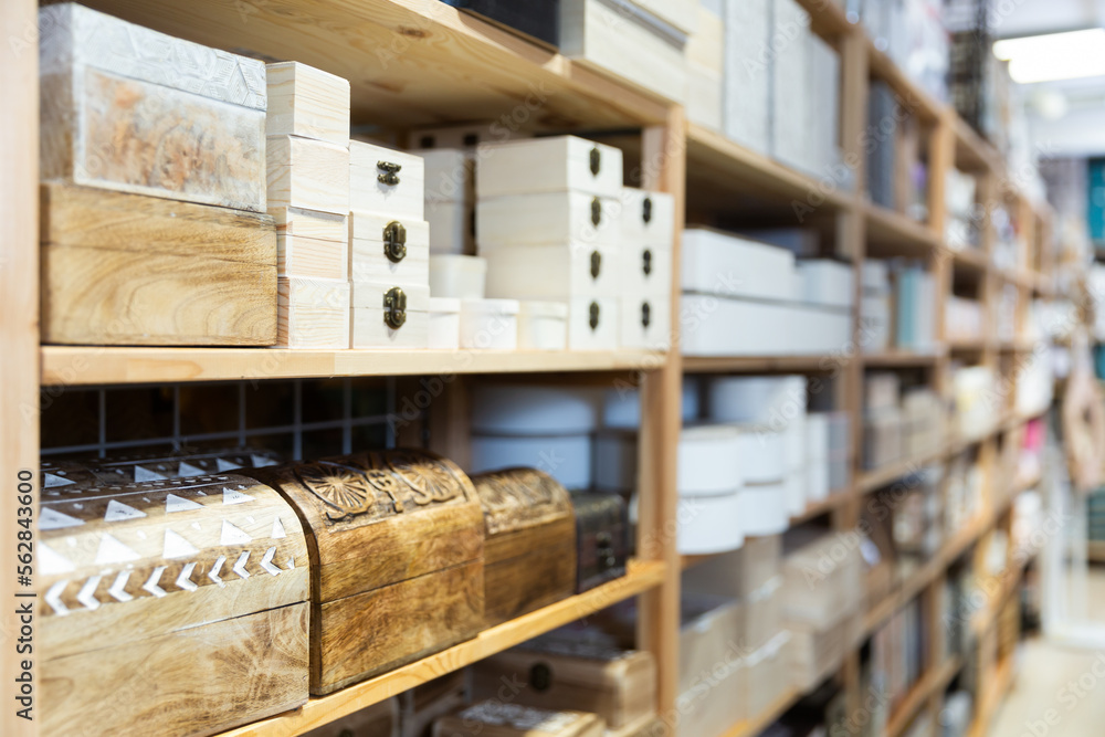 Supermarket of household goods - wooden original caskets on shelves store
