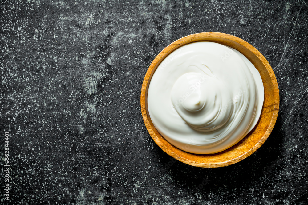 Mayonnaise in a wooden plate. Mayonnaise in a wooden plate.