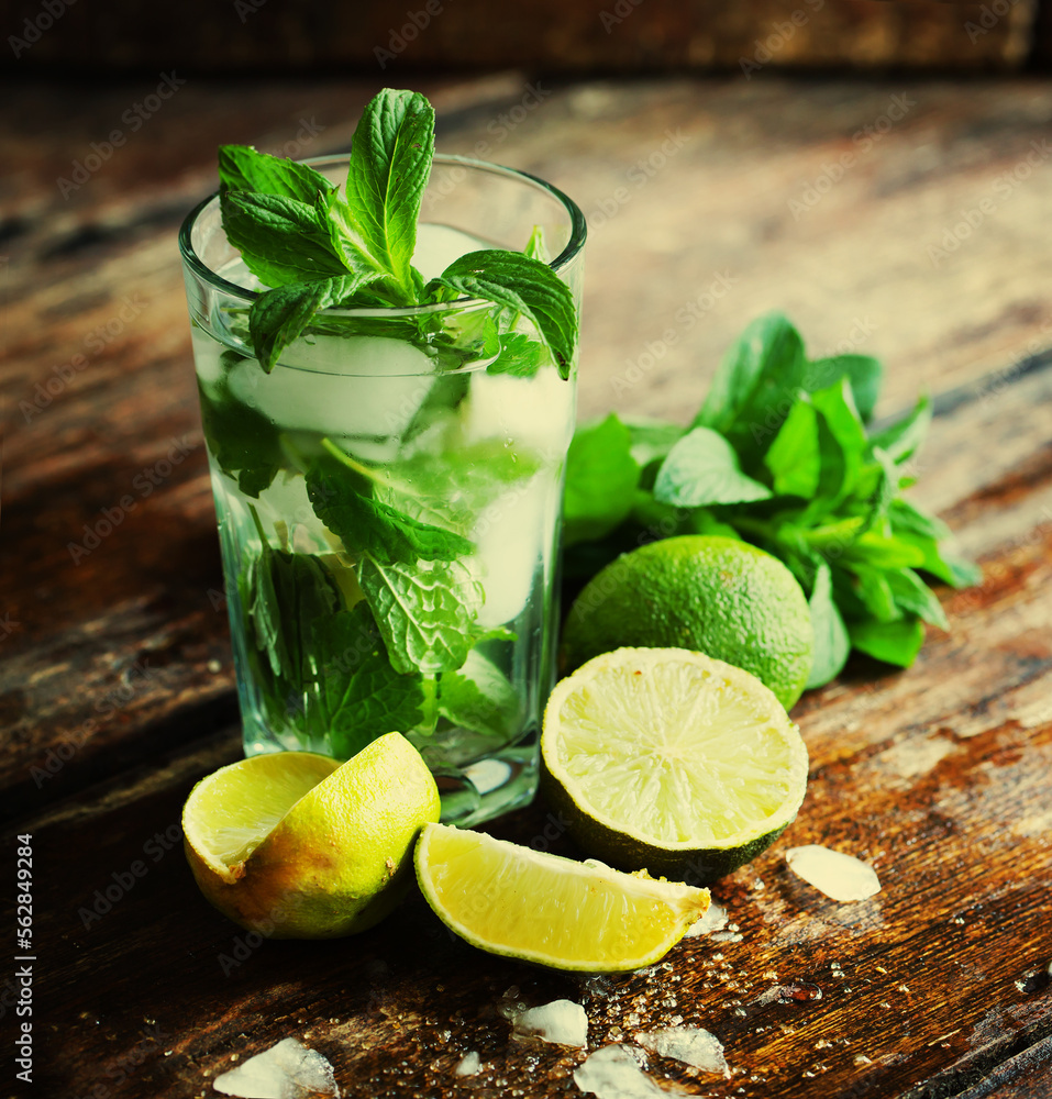 summer coctail background with fresh Mojito over rustic wooden background summer coctail background with fresh Mojito over rustic wooden background