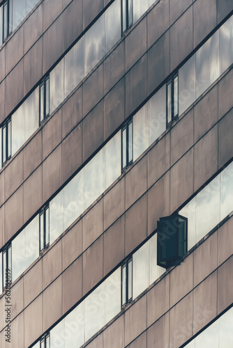 City business buildings architecture exterior abstract balanced pattern glass windows reflection 