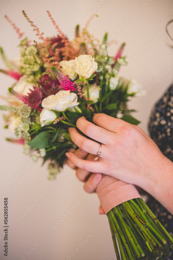 Flowers bouquet with female hand