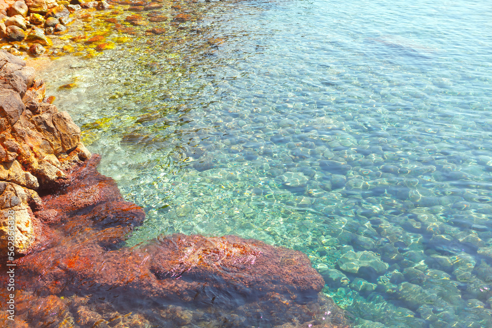 Transparent Water Over Rocks . Stones on the sea bottom 