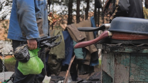 Beggars huts of homeless people near the landfill. © Довидович Михаил