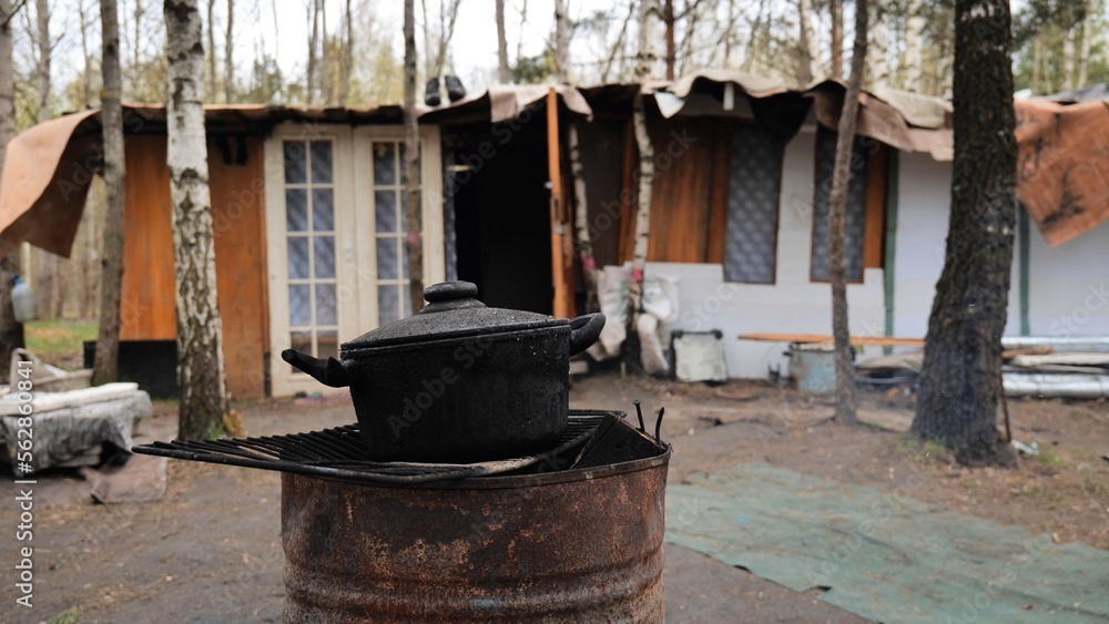 Beggars huts of homeless people near the landfill.