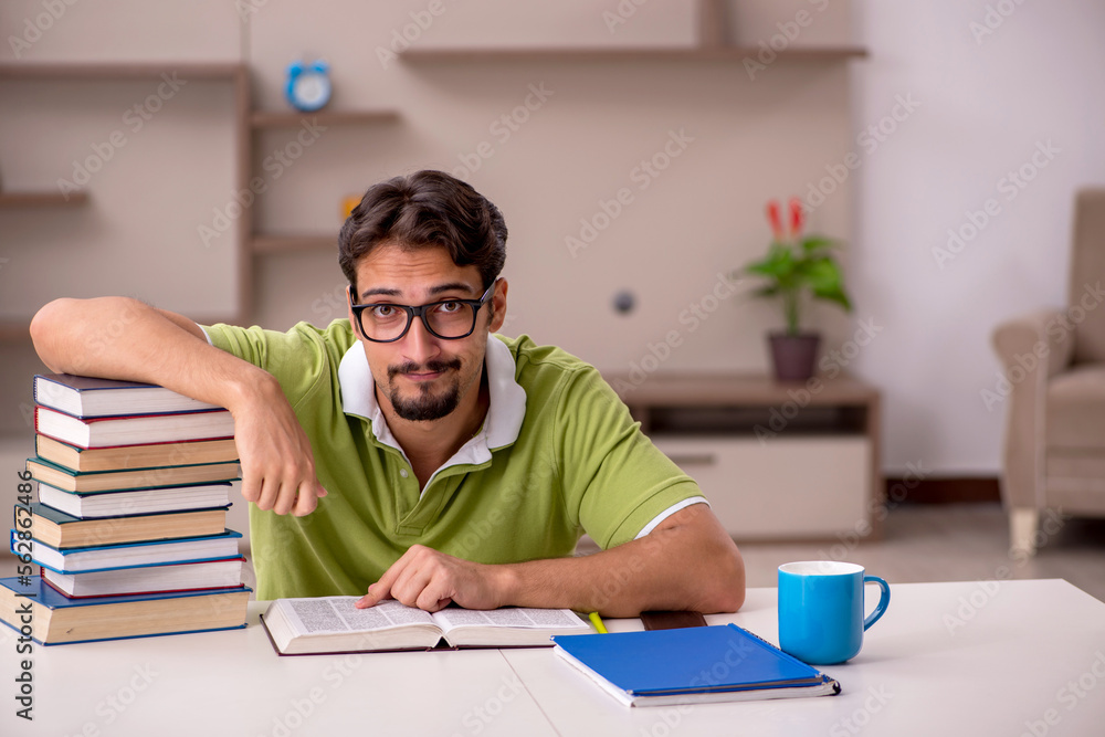 Young male student studying at home Young male student studying at home