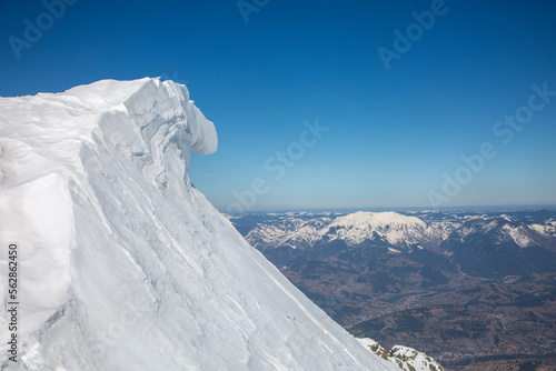 snow cornice in the mountains in the Rodna Mountains in the region of Maramures. Pietrosul Rodnei is the highest peak in all of the Eastern Carpathians photo