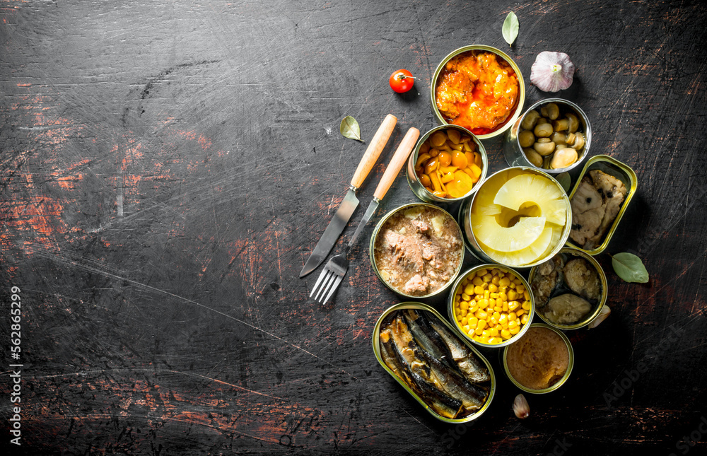 Open tin cans of canned mushrooms, pineapples, corn, meat and fish. Open tin cans of canned mushrooms, pineapples, corn, meat and fish.
