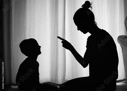 Fotografie Mother parent correcting, disciplining her child for bad behavior