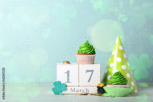 Tasty cupcakes, party hat a...