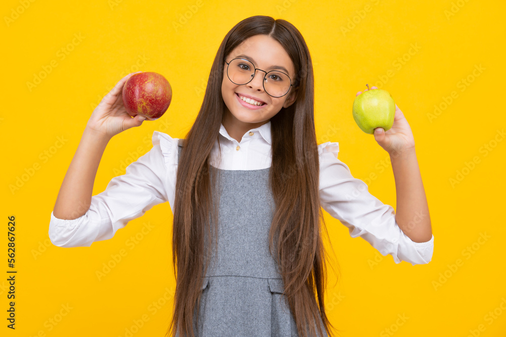 Fresh apple. Teenager girl hold apples on yellow isolated studio background. Child nutrition. Happy girl face, positive and smiling emotions. Fresh apple. Teenager girl hold apples on yellow isolated studio background. Child nutrition. Happy girl face, positive and smiling emotions.