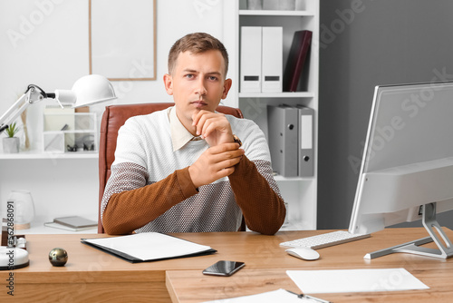 Young businessman with wris...