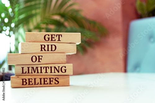 Wooden blocks with words 'Get Rid Of Limiting Beliefs'. photo