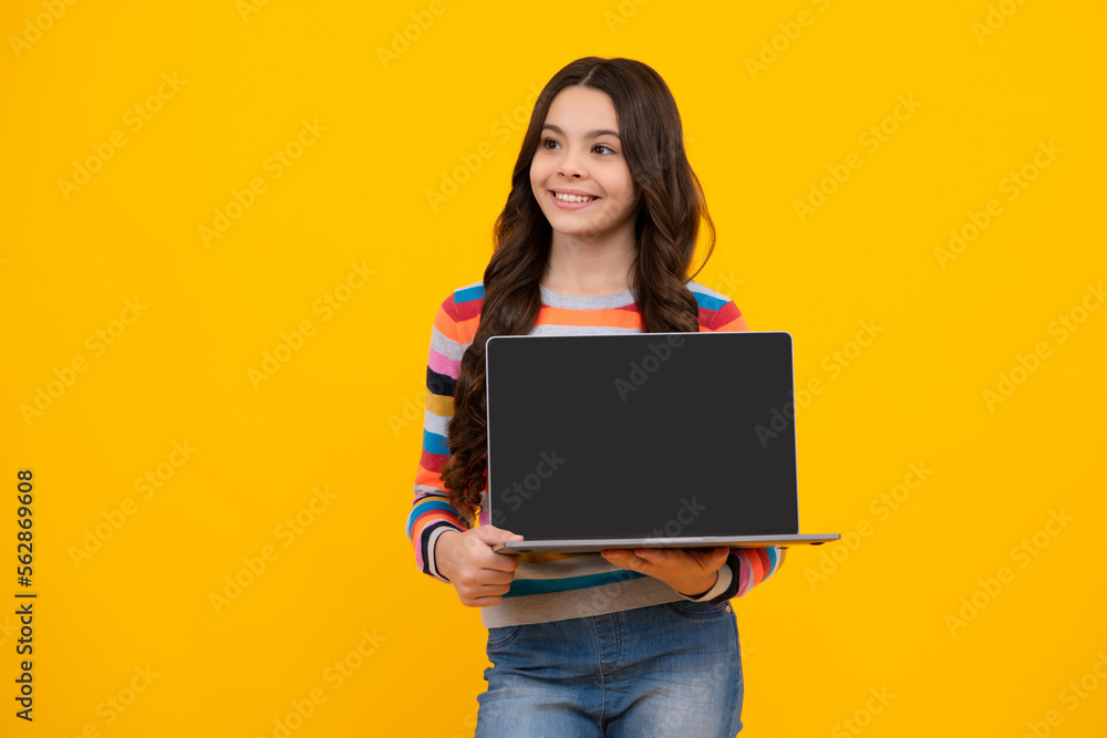 Back to school, Teenager school girl with laptop computer. Screen of laptop computer with copy space mockup. Happy teenager, positive and smiling emotions of teen schoolgirl. Back to school, Teenager school girl with laptop computer. Screen of laptop computer with copy space mockup. Happy teenager, positive and smiling emotions of teen schoolgirl.