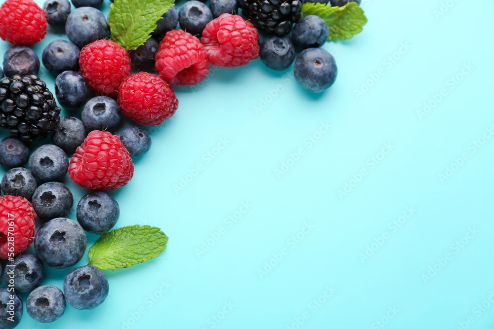 Fototapeta premium Composition with fresh berries and mint leaves on color background