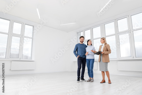 Real estate agent showing new apartment to couple © New Africa