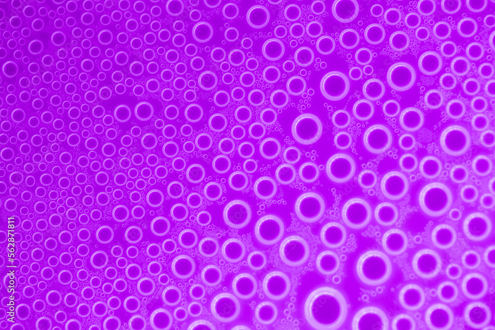 Bubbles purple background.Macro round bubbles texture in lilac tones.beautiful background with circles.Purple pattern with circles.