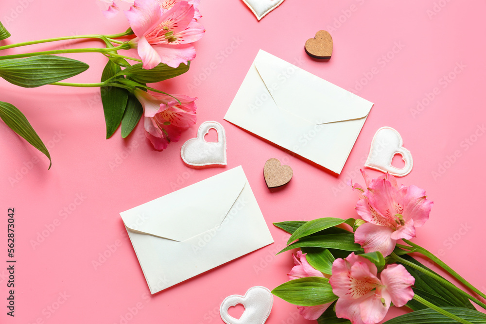 Composition with beautiful alstroemeria flowers, envelopes and decor on pink background. Mother's day celebration Composition with beautiful alstroemeria flowers, envelopes and decor on pink background. Mother's day celebration