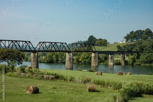 Wallpaper Mural Old Railroad Bridge Crossing the River by a Bank of Hay Bales in Tennessee Torontodigital.ca