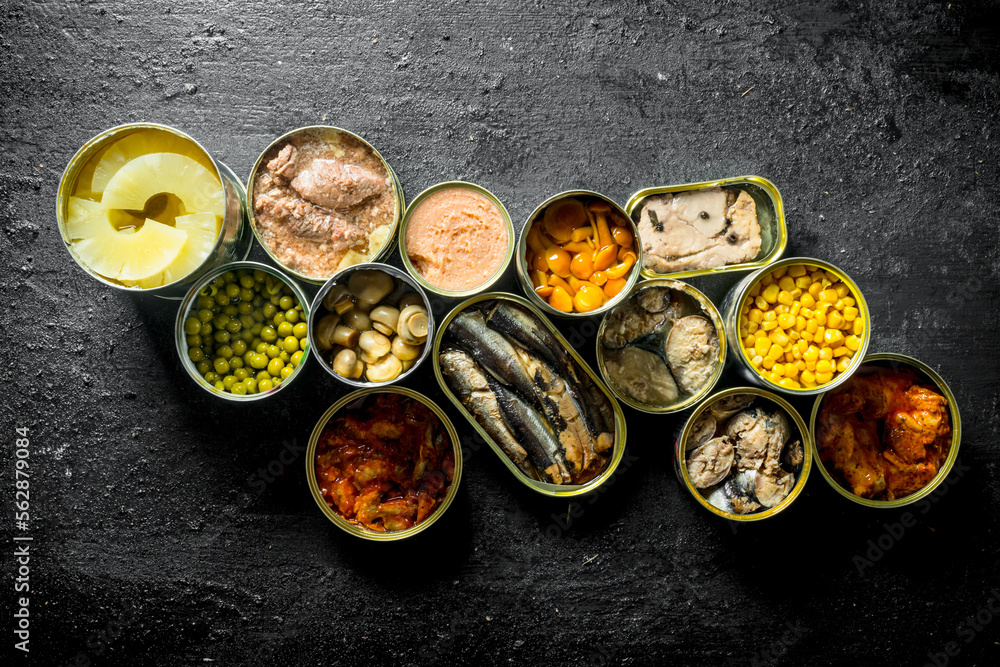 Group of open tin cans with canned food. Group of open tin cans with canned food.