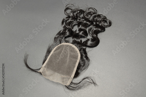 loose wavy black color human hair weaves extensions lace closure on black background