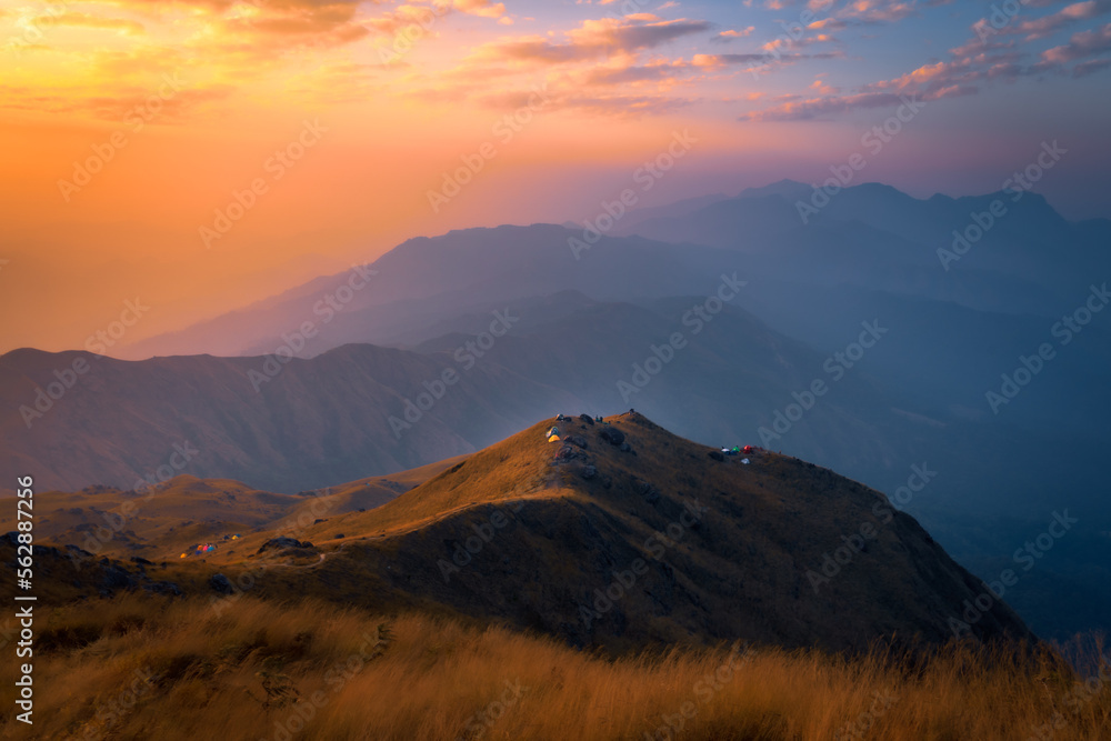 Light rays hitting mountain peaks at sunrise in Burma