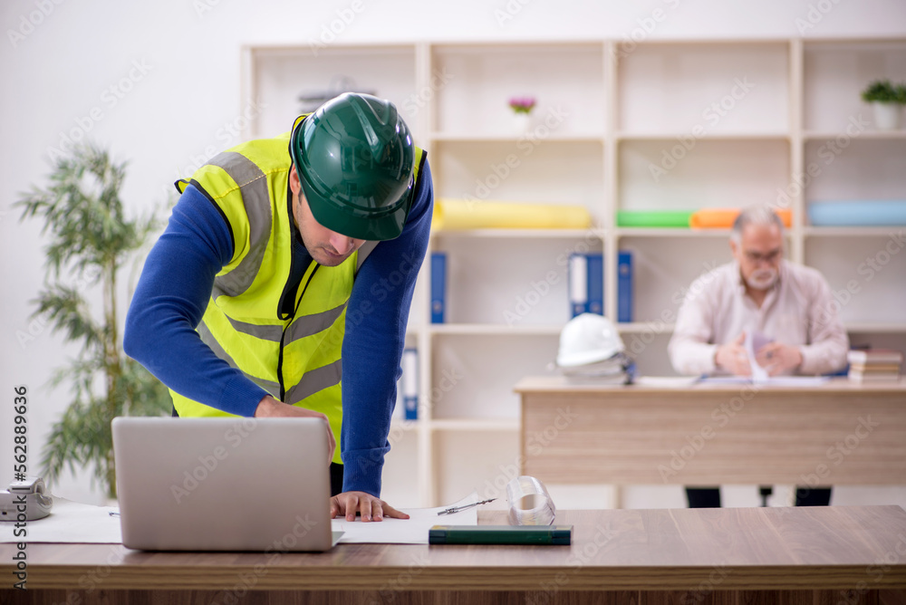 Two male architects working on the project Two male architects working on the project