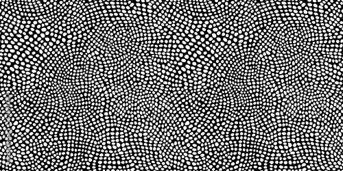 Seamless hand drawn small dense polkadot animal spots pattern in white on black background. Abstract aboriginal dot art motif or organic cellular texture in a trendy doodle line art or linocut style. photo