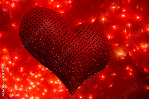3D image of a heart on a red background with bokeh.