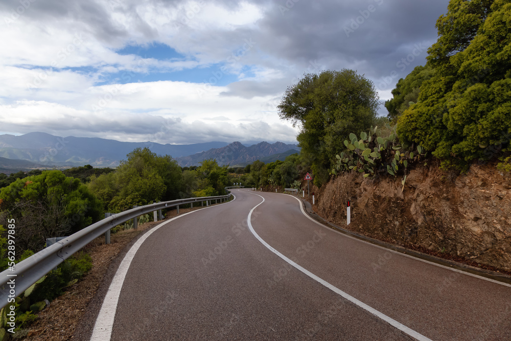 Fototapeta premium Scenic Highway, Orientale Sarda, in the mountain landscape. Cloudy Rainy Day. Sardinia, Italy.