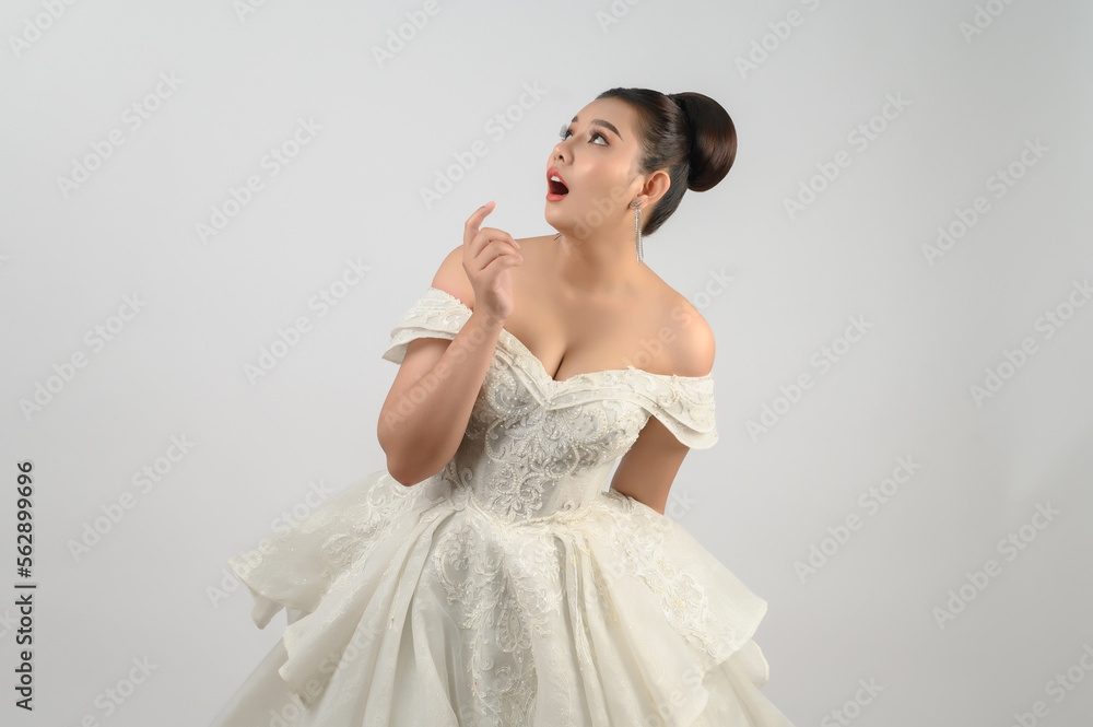 Young asian beautiful bride pose with excited feel on white background Young asian beautiful bride pose with excited feel on white background