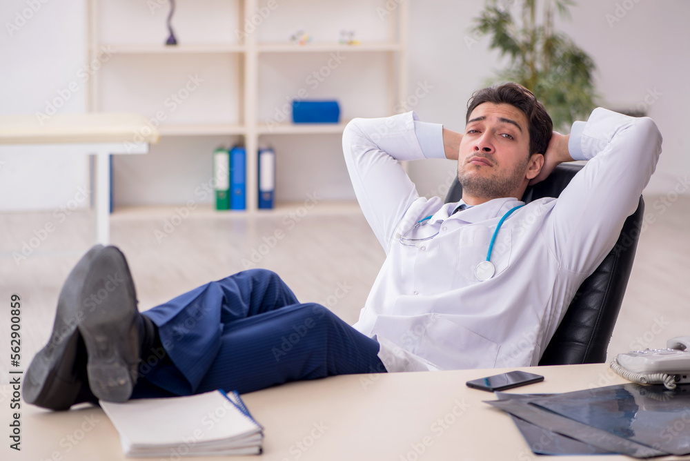Young male doctor working in the clinic Young male doctor working in the clinic