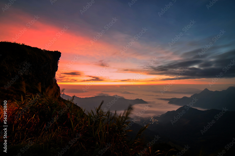 Sunrise over the mountains at Phu Chi Fah in Thailand