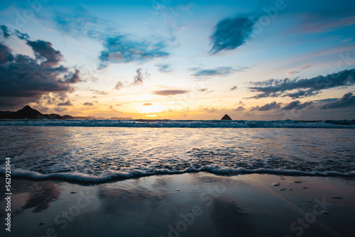 Obraz na płótnie Stunning seascape with some waves crashing on a beach during a beautiful sunset. Lombok Island, West Nusa Tenggara, Indonesia. w salonie