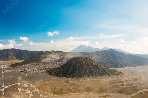 Obraz na płótnie View from above, stunning panoramic view of the Mt Batok, Mt Bromo and the Mt Semeru in the distance during a sunny day. Mount Bromo is an active volcano in East Java, Indonesia. w salonie