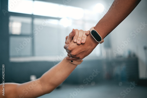 Partnership, hands and motivation at gym by personal trainer and person for wellness, goal and help. Hand, support and people helping, encourage and lifting on weight loss, exercise and fitness guide © Delcio/peopleimages.com