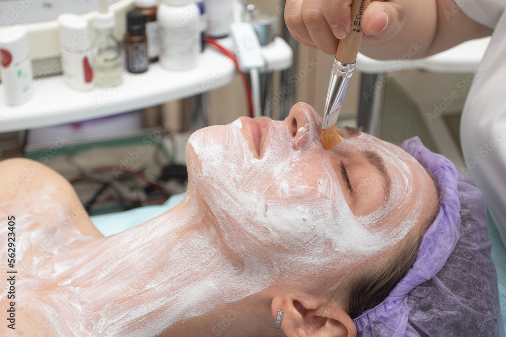 Woman having mask procedure in spa a beauty salon Woman having mask procedure in spa a beauty salon