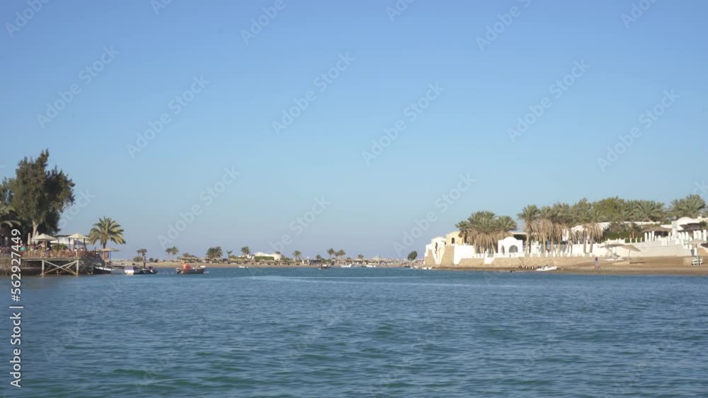 Modern City El Gouna in Egypt. Buildings and Canals in El Gouna. View From a Floating Ship. El Gouna is a Tourist Resort on the Red Sea Coast, Part of the Egyptian Riviera. Modern City El Gouna in Egypt. Buildings and Canals in El Gouna. View From a Floating Ship. El Gouna is a Tourist Resort on the Red Sea Coast, Part of the Egyptian Riviera.