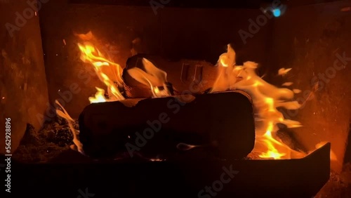 Hot fireplace full of burning wood and fire. High quality FullHD footage. Slow motion fire