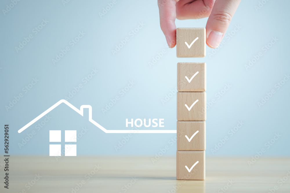Home buying checklist and hand holding complete check mark. Business and financial, Hire a Real Estate, Refinance, House purchase, Loan, Tax, Mortgage, Asset management and Property investment. - obrazy, fototapety, plakaty 