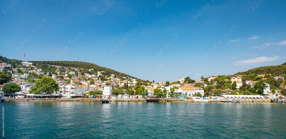 Panoramic sea view of the city with old houses in the mountains and a pier on the Adalar Islands, Turkey