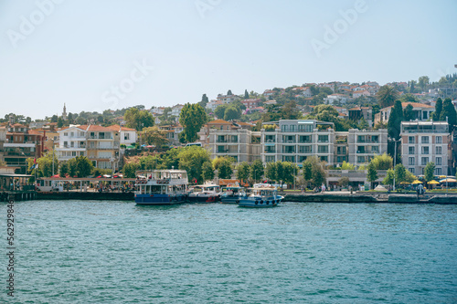 Panoramic sea view of the resort town with houses in the mountains and a pier with boats on a Adalar Islands