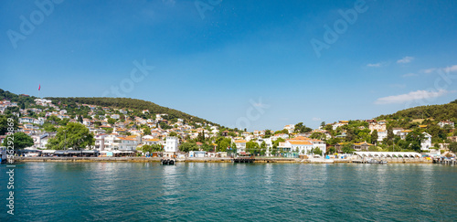 Panoramic sea view of the city with old houses in the mountains and a pier on the Adalar Islands, Turkey © Kufotos
