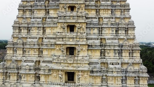 Aerial view of Sri Kanchi Kamakshi Amman Temple in Kanchipuram, Tamil Nadu. Close-up of temple tower with beautiful God, and animal sculptures which are carved and sculpted mostly out of sandstone. photo