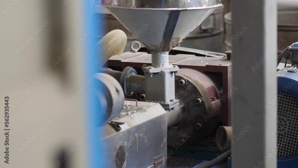 View Of Machinery Covered In Dust At Plastics Factory. Slow Motion View Of Machinery Covered In Dust At Plastics Factory. Slow Motion