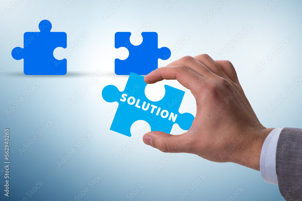 Business solution concept with jigsaw puzzle pieces Business solution concept with jigsaw puzzle pieces