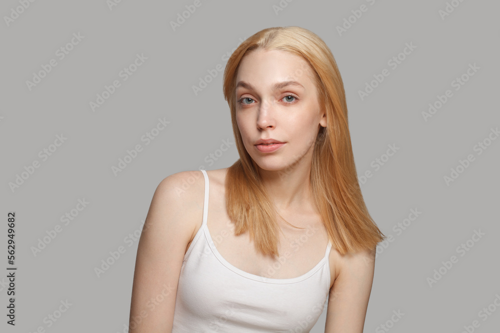 Perfect female model woman with blonde hairstyle and natural makeup posing on white background Perfect female model woman with blonde hairstyle and natural makeup posing on white background