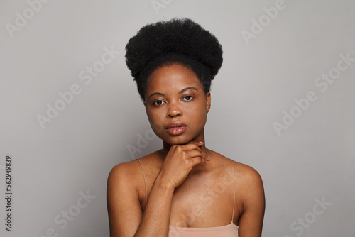 Portrait of young woman with fresh shiny dark skin